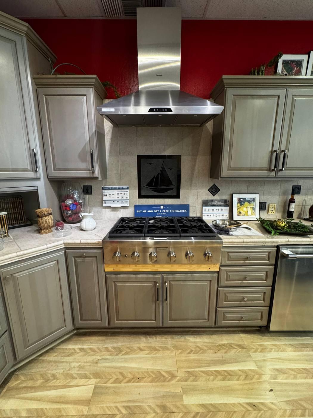 A full kitchen display with a Wolf range in the showroom