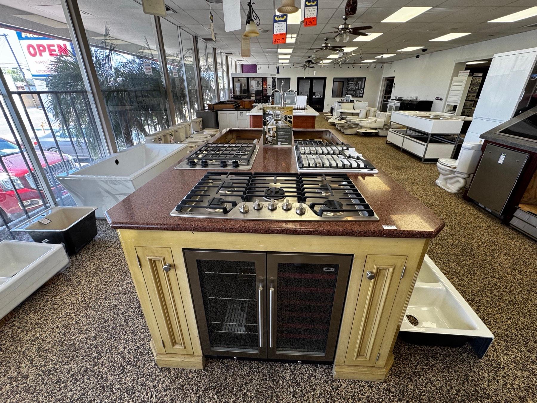 The appliance showroom floor with cooktop displays