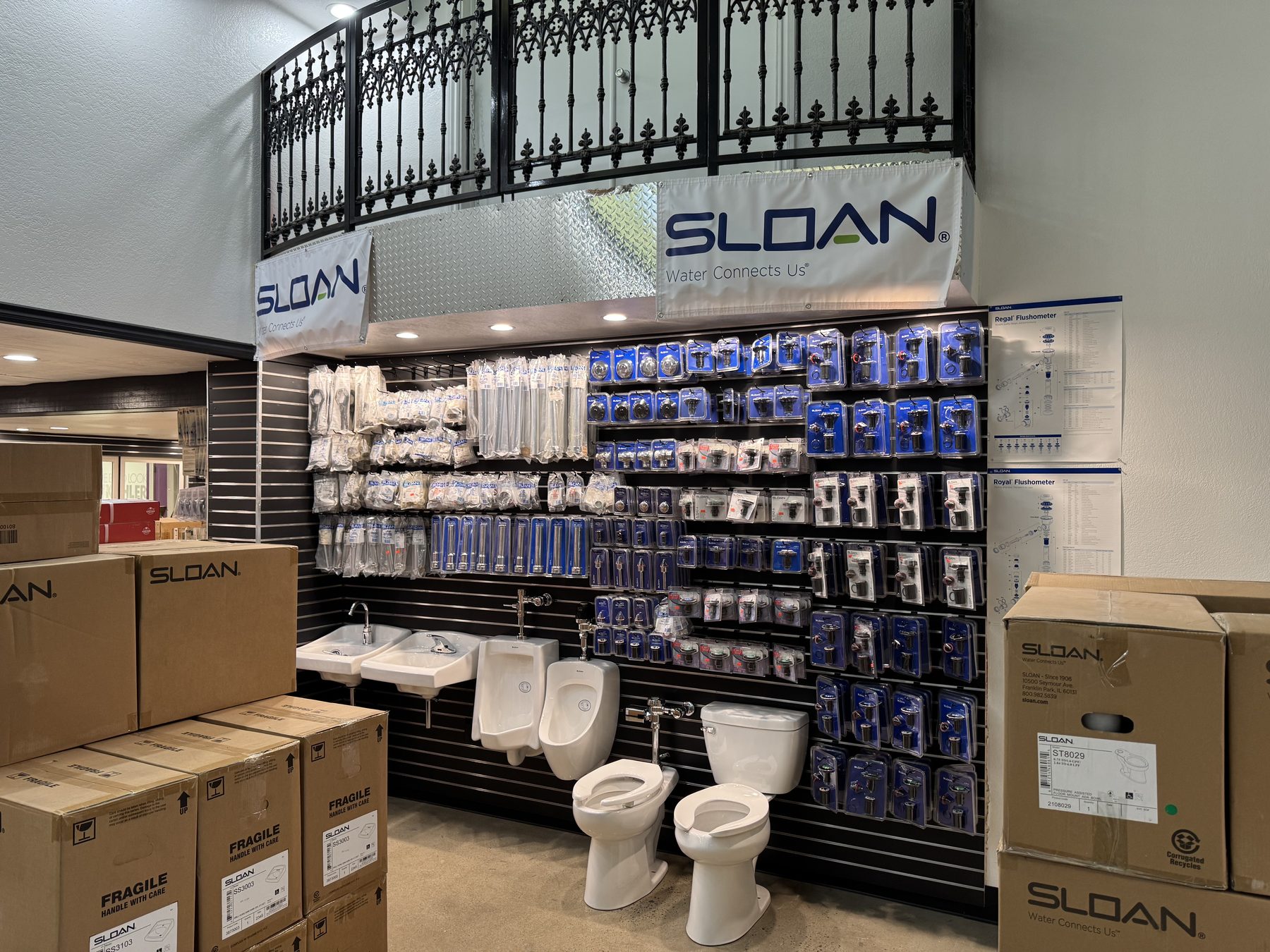 The Sloan repair parts wall inside Fresno Distributing, with flushometer displays and fixtures