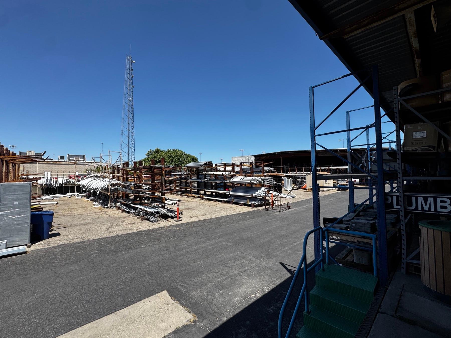 A full pipe yard, racked by size and material